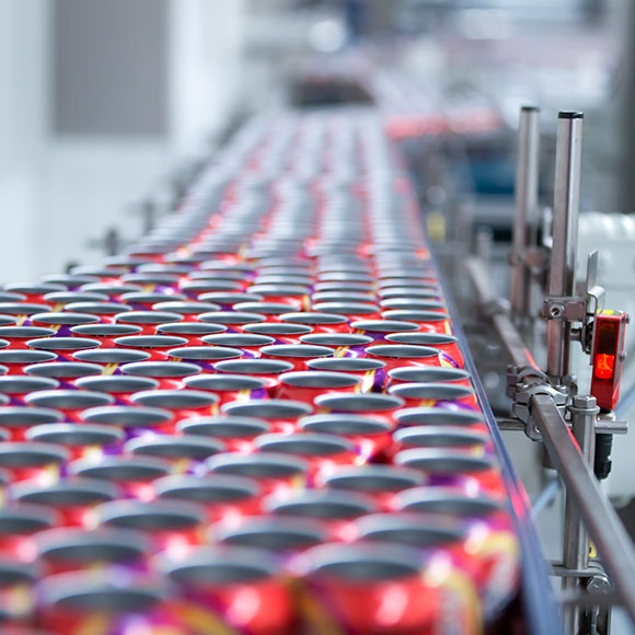 Soda cans on production line