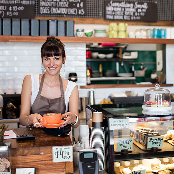 Barista serving coffee