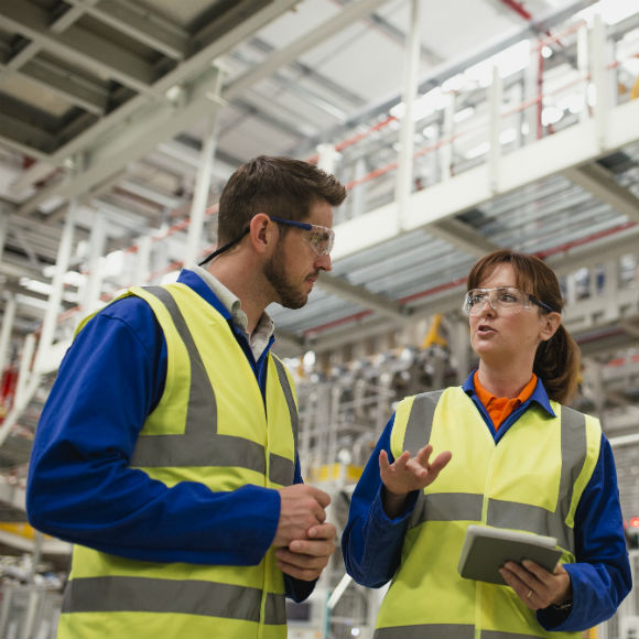 Factory workers talking